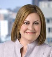 A person smiling for the camera  Description generated with very high confidence