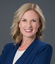 A person in a blue shirt  Description generated with very high confidence